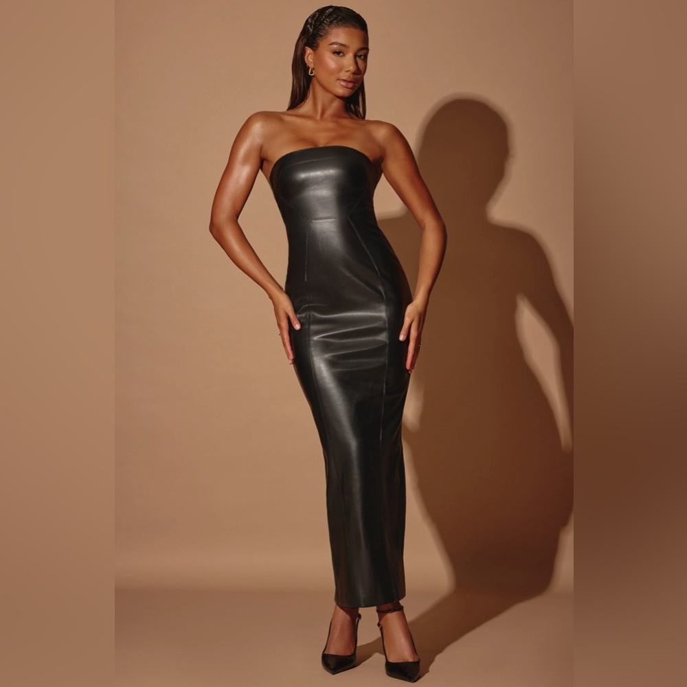 Black, vegan leather strapless dress with cutout in back, by Oh Polly. Size 0.